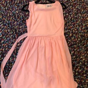 Pastel pink chiffon dress.